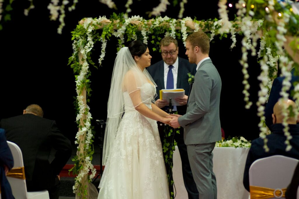A happy couple with their wedding officiant after the ceremony. — Las Vegas wedding packages