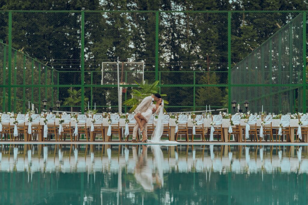 A lively summer wedding reception by the poolside at a Las Vegas resort. — best season for Las Vegas wedding