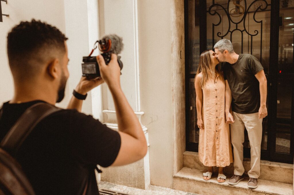 A professional photographer capturing a romantic moment during an elopement. — elopement Las Vegas guide