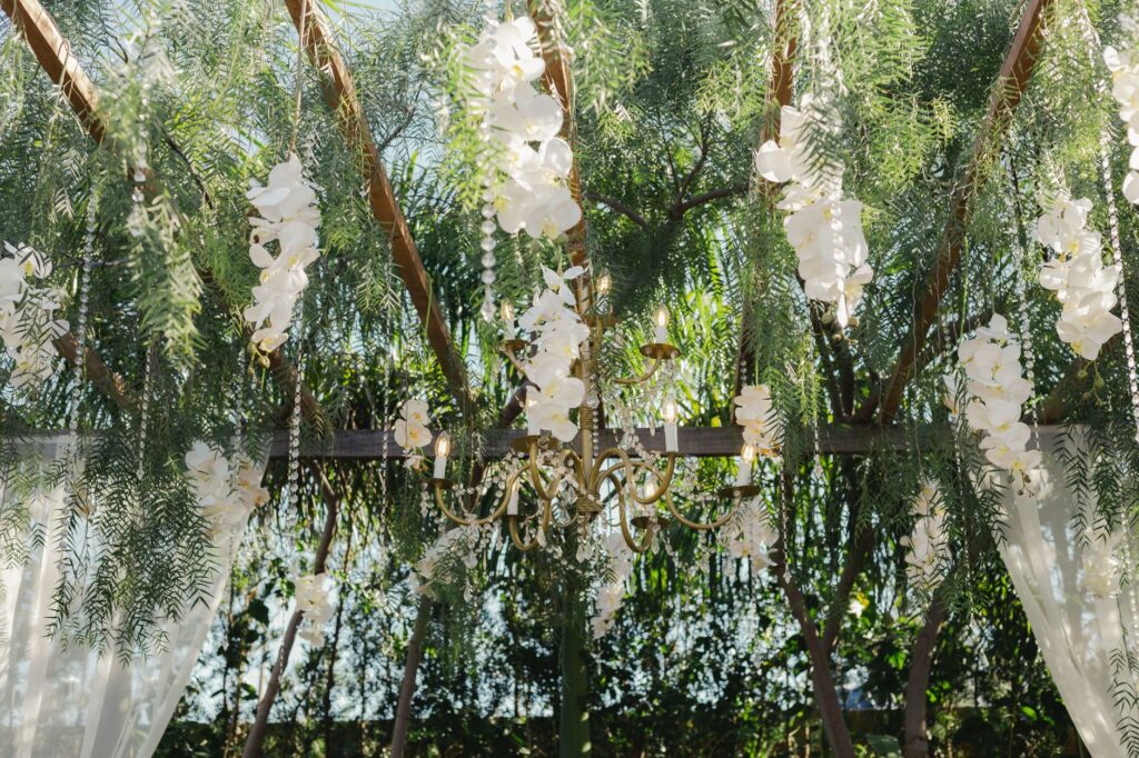 A stunning outdoor ceremony at the Bellagio's Enchanted Garden, featuring lush floral arrangements. — romantic wedding p…