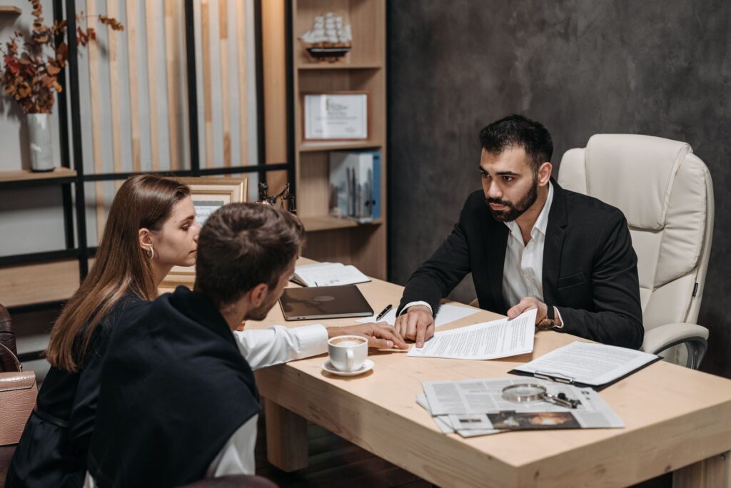 A wedding planner reviewing a timeline with clients. — questions for wedding planner Las Vegas