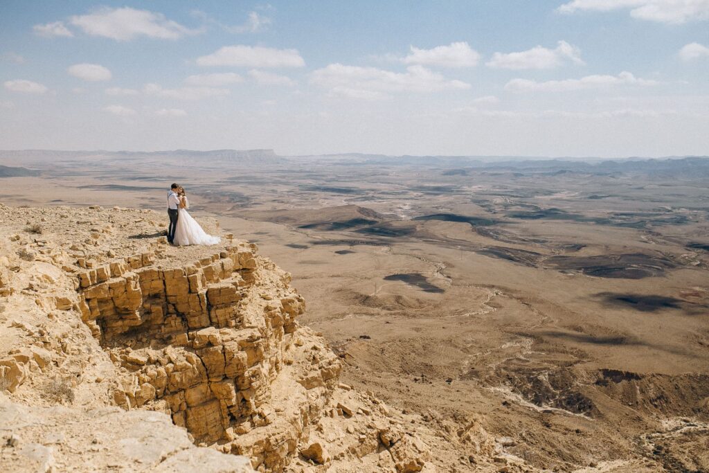 An adventurous outdoor wedding with a stunning desert backdrop and unique activities. — unique wedding themes Las Vegas