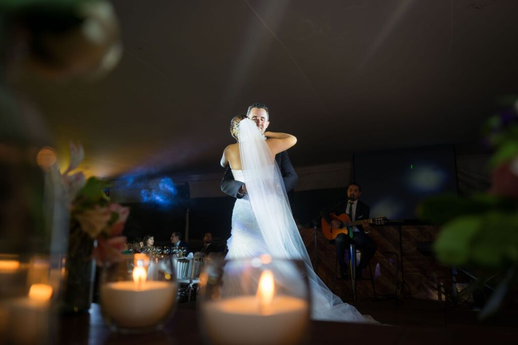 An elegant couple enjoying their first dance with a live band in the background. — Vegas entertainment wedding