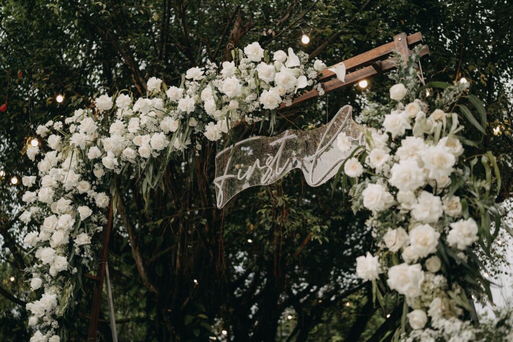 An enchanting garden wedding scene with fairy lights and lush greenery. — unique wedding themes Las Vegas