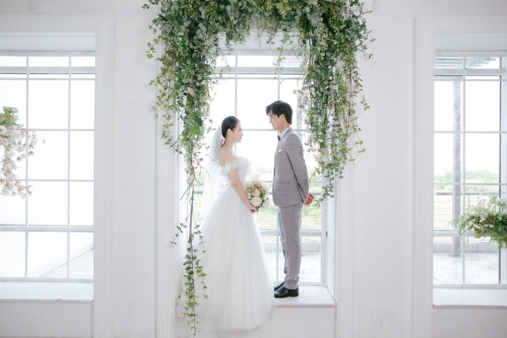 An intimate couple exchanging vows under a beautiful arch. — Las Vegas wedding package