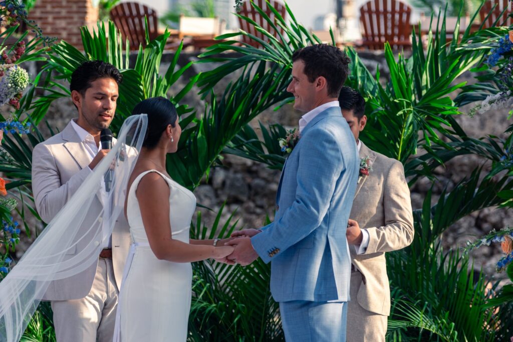 An officiant performing a wedding ceremony at a picturesque outdoor venue. — getting married in Las Vegas