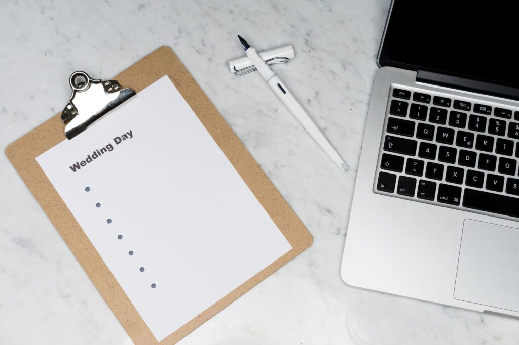 An organized wedding day itinerary displayed on a clipboard. — Las Vegas wedding checklist