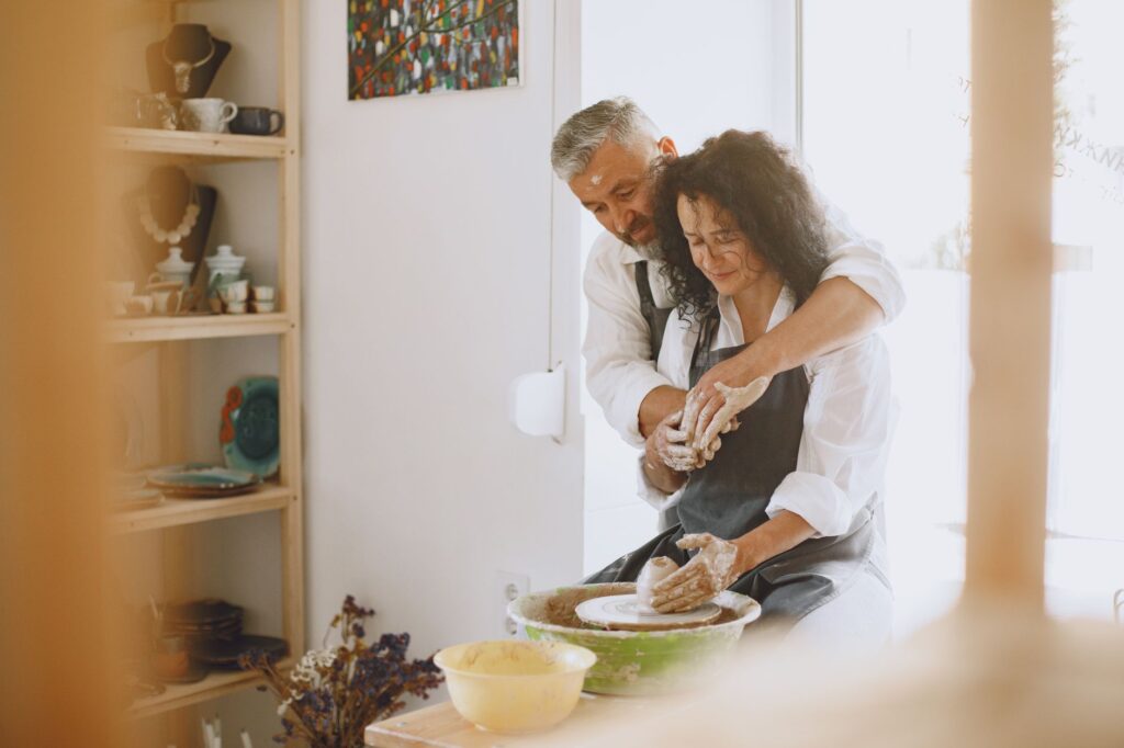 Couple creating DIY wedding favors at home. — budget wedding ideas Las Vegas
