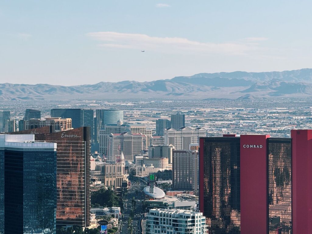 Couple exchanging vows with iconic Las Vegas skyline in the background. — Las Vegas wedding culture