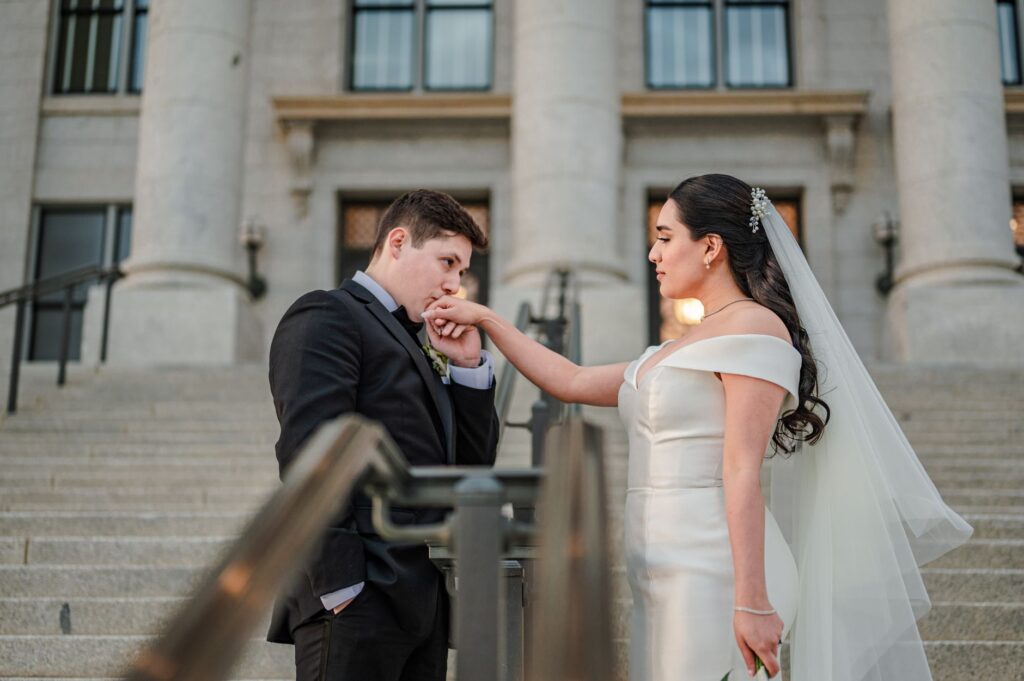 Couple holding their Las Vegas marriage license outside the courthouse. — getting married in Las Vegas checklist