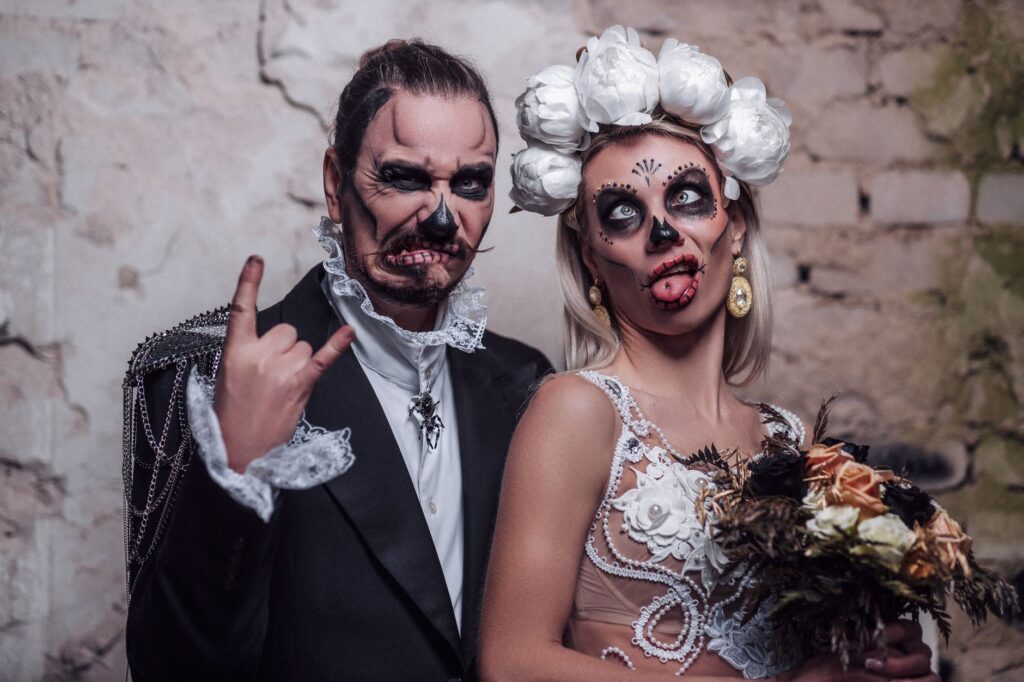 Couples enjoying a themed wedding with creative costumes and vibrant colors. — unique wedding themes Las Vegas