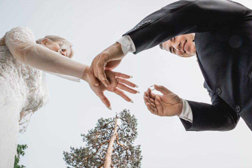 Couples exchanging vows outdoors under a bright summer sun. — best time to get married Las Vegas