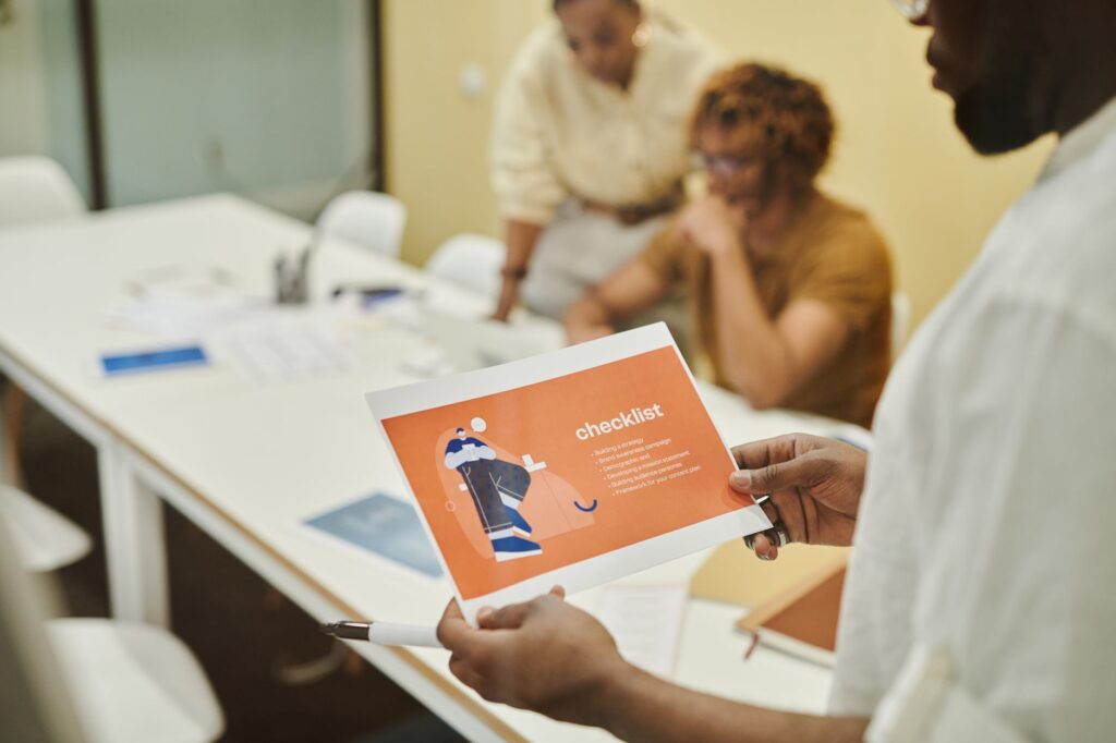 A checklist of important questions laid out on a table during a vendor meeting. — questions for wedding vendor Las Vegas