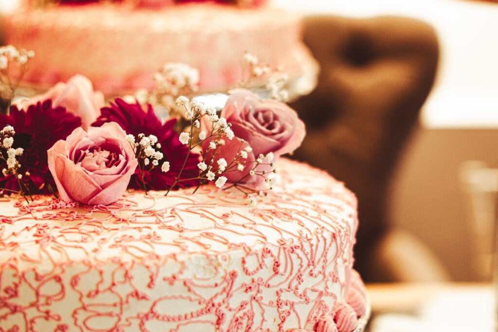 A close-up of a wedding cake adorned with Vegas-themed decorations. — Las Vegas destination wedding