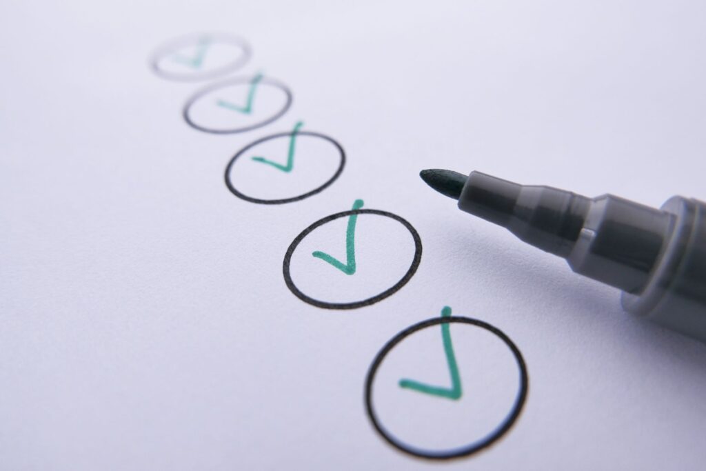 A close-up of a wedding checklist with a pen ready to mark items off. — planning Las Vegas destination wedding