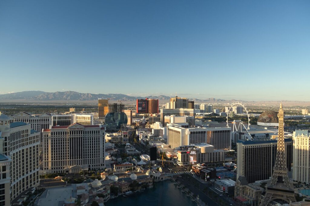 A close-up of wedding rings with a Las Vegas skyline backdrop. — Las Vegas wedding photographers