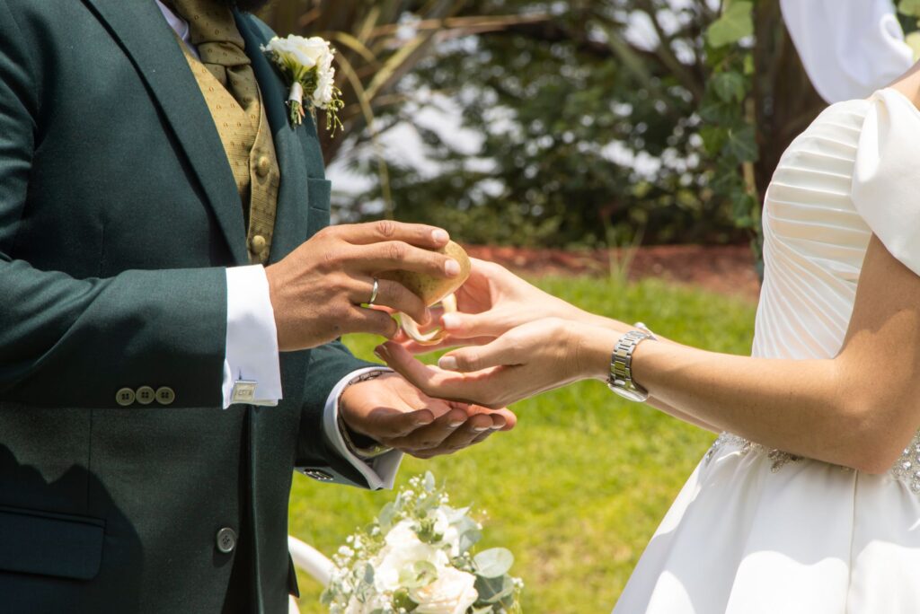 A couple exchanging vows in a beautiful Las Vegas garden. — elopement planning Las Vegas