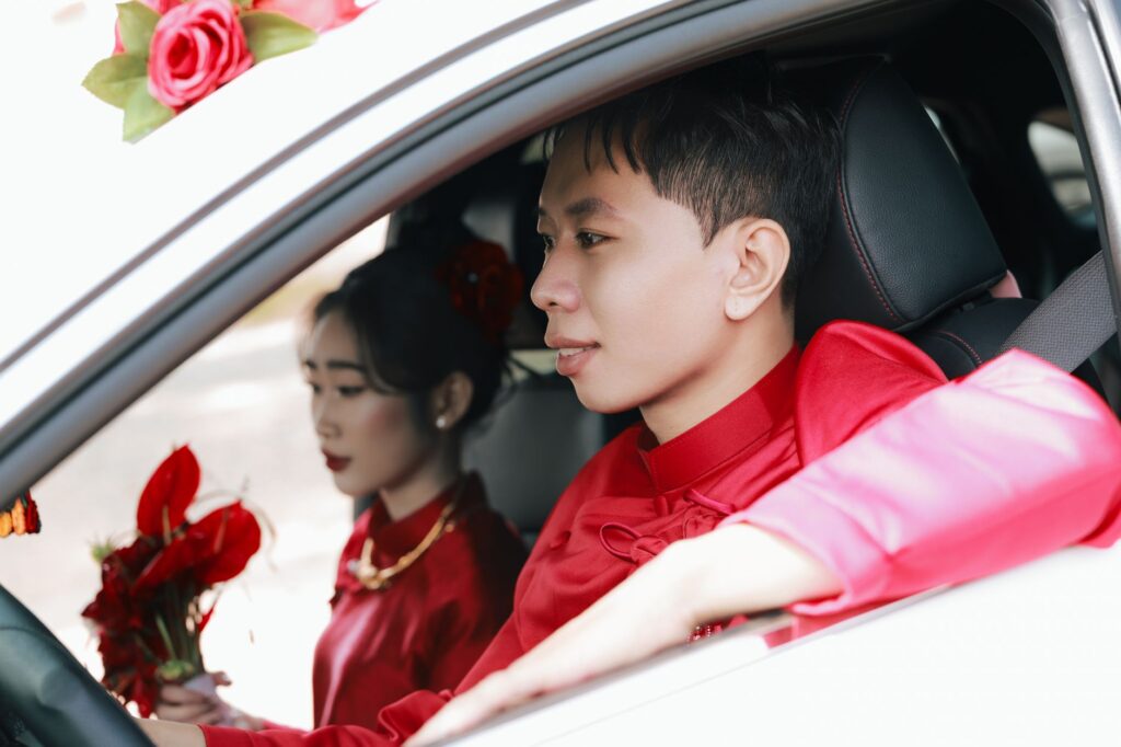 A drive-thru wedding setup with a couple inside a decorated car during their ceremony. — Las Vegas wedding traditions