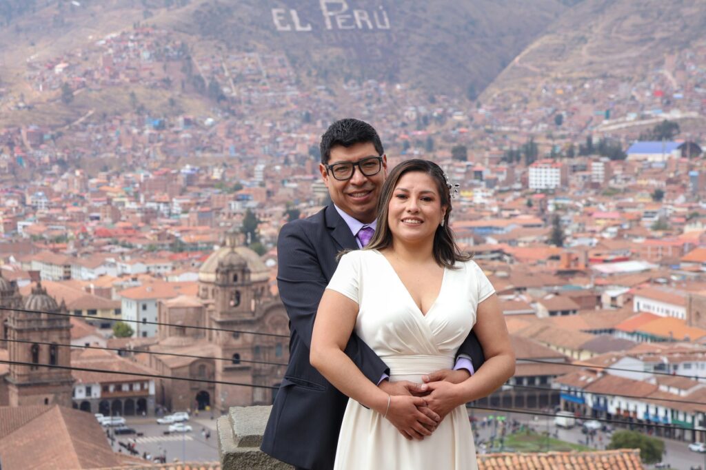 A happy couple celebrating their destination wedding with city lights in the background. — destination wedding Las Vegas