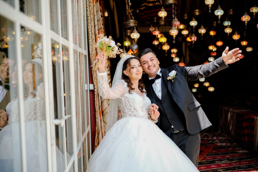 An image of a couple happily holding their marriage license in front of a Las Vegas landmark. — Las Vegas wedding laws