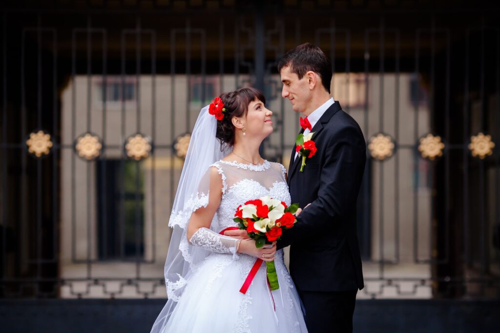 Brides and grooms in themed attire, like Elvis or classic Hollywood, highlighting unique Las Vegas wedding themes.