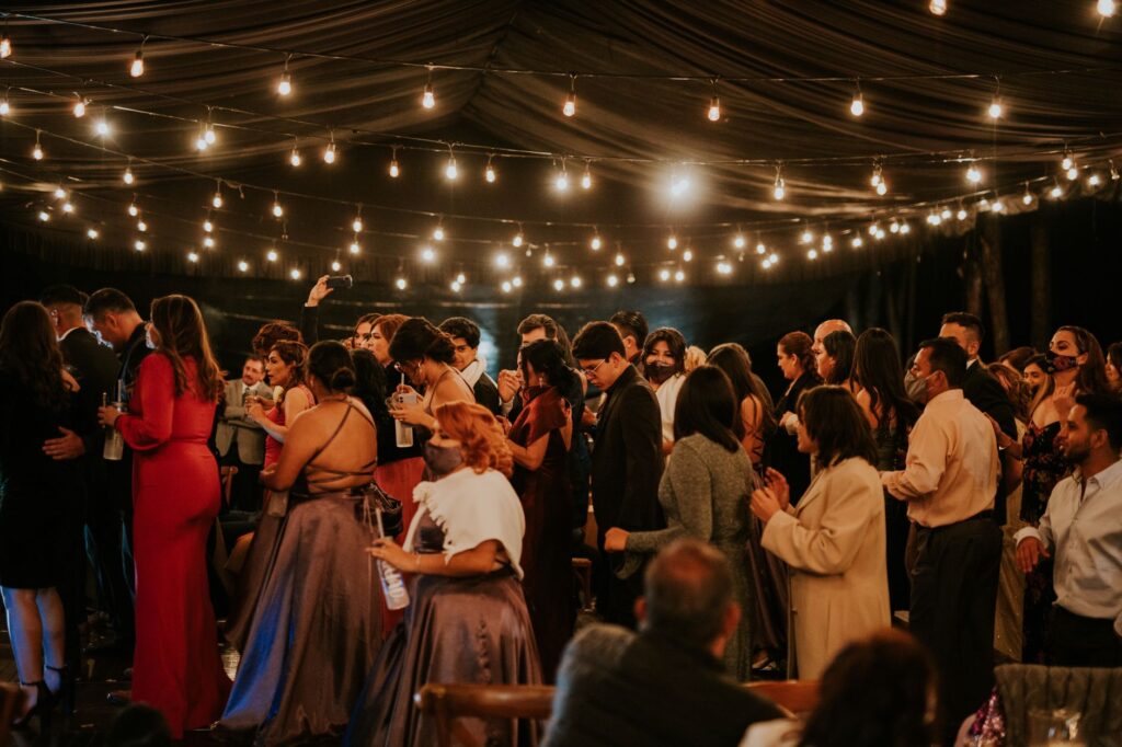 Guests enjoying a Las Vegas wedding reception with city lights in the background. — getting married in Las Vegas