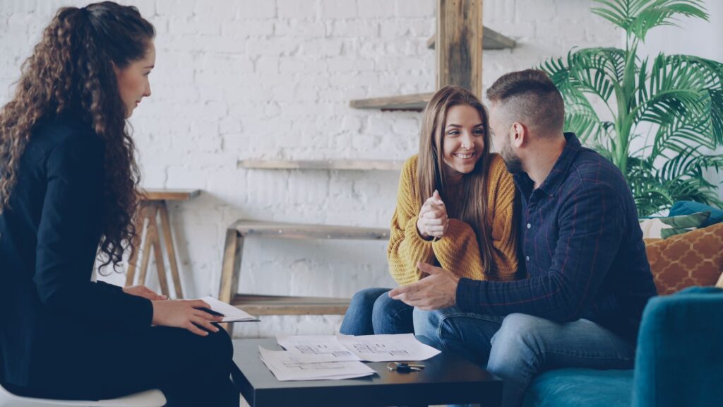 Wedding concierge discussing plans with a couple — choose wedding concierge Las Vegas